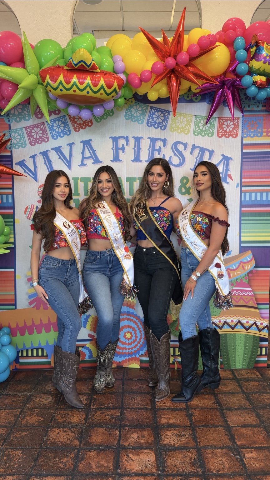 Four brand representatives at a colorful event installation